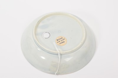 Lot 34 - A Worcester 'Lord Rodney' type saucer dish, circa 1770, painted with a colourful bird, swags of fruit and insects, with gilded blue edges, 16cm diameter