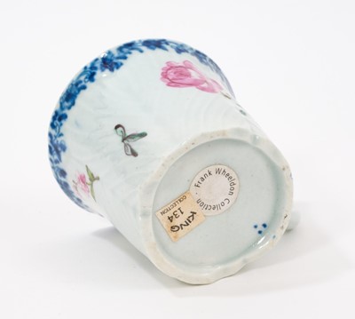 Lot 2 - A Worcester coffee can, circa 1755, of feather-moulded, tapering form with an ear-shaped handle, London-painted with colourful European flowers beneath an underglaze blue fol...