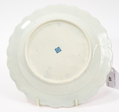 Lot 45 - A Worcester scalloped dessert plate, circa 1770, decorated in the workshop of James Giles, painted in the centre with a classical urn, draped in garlands of pink coloured flowers, rich gilt bord...