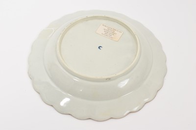 Lot 46 - A Worcester scalloped dessert plate, circa 1770, decorated in the workshop of James Giles, painted in the centre with a classical urn, draped in garlands of pink coloured flowers, rich gilt bord...