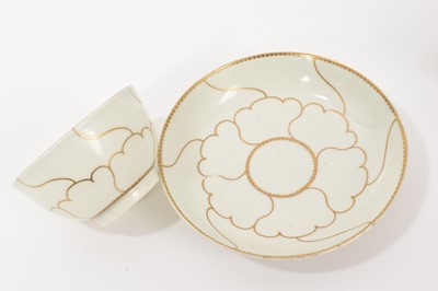 Lot 27 - A Worcester fluted tea bowl and saucer, circa 1775, polychrome painted with swags of flowers in Hop Trellis style, on turquoise scale ground, the saucer 13.5cm diameter, together with a Queen's...