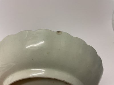 Lot 27 - A Worcester fluted tea bowl and saucer, circa 1775, polychrome painted with swags of flowers in Hop Trellis style, on turquoise scale ground, the saucer 13.5cm diameter, together with a Queen's...