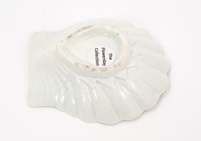 Lot 3 - An early Worcester pickle dish, circa 1753-54, formed as a scallop shell, painted in polychrome enamels with a central flower spray and a border of continuous flowering stems, 7.5cm...