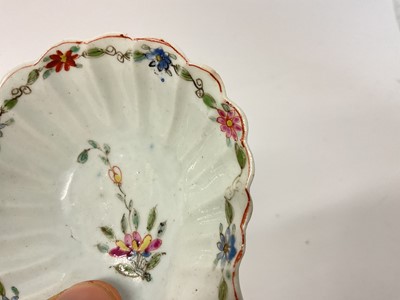 Lot 3 - An early Worcester pickle dish, circa 1753-54, formed as a scallop shell, painted in polychrome enamels with a central flower spray and a border of continuous flowering stems, 7.5cm...