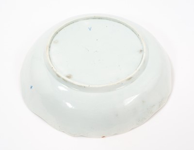 Lot 23 - Rare and early Worcester blue and white junket dish, circa 1758, painted with three landscape panels in the Neighbours pattern on a basket-weave moulded ground, the shaped rim with flowers and...