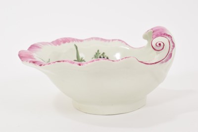 Lot 13 - A Worcester shell-shape sweetmeat dish, circa 1758, painted with a spray of flowers, scattered sprigs, within a puce border 12cm wide