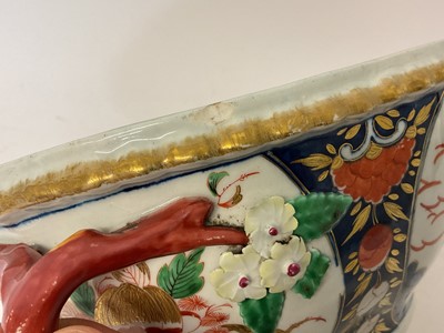 Lot 31 - A rare Worcester tureen and cover, circa 1770, painted in the Pavilion pattern, with naturalistic handles, 29cm wide including handles