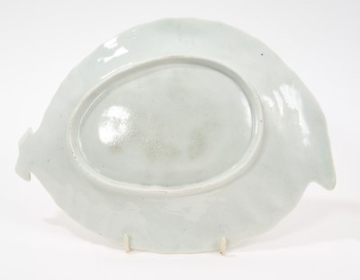 Lot 15 - A Worcester cabbage leaf dish, circa 1755-60, painted with flowers, rockwork and a moth, in the Chinese style with 'famille verte' enamels, the edge with floral panels on a diaper ground, 25.5cm...