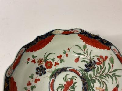 Lot 30 - Three Worcester chocolate cups and saucers, circa 1770, the first decorated in the Queen's pattern, the second Kempthorne (all four pieces with square marks), and the third in turquoise and gilt...