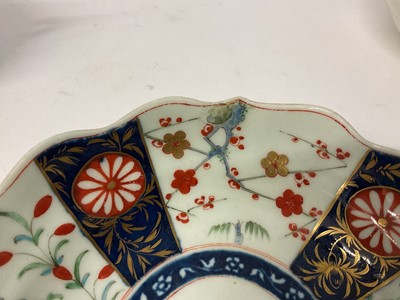 Lot 30 - Three Worcester chocolate cups and saucers, circa 1770, the first decorated in the Queen's pattern, the second Kempthorne (all four pieces with square marks), and the third in turquoise and gilt...