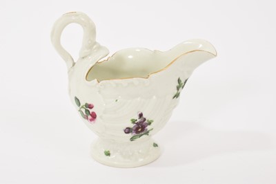 Lot 24 - A Worcester Dolphin Ewer cream boat, circa 1770, with crisp moulding, polychrome painted with floral sprays, gilt rim, 8.25cm high