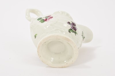 Lot 24 - A Worcester Dolphin Ewer cream boat, circa 1770, with crisp moulding, polychrome painted with floral sprays, gilt rim, 8.25cm high