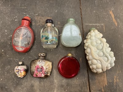 Lot 95 - Group of old Chinese snuff bottles to include two carved green hardstone snuff bottles