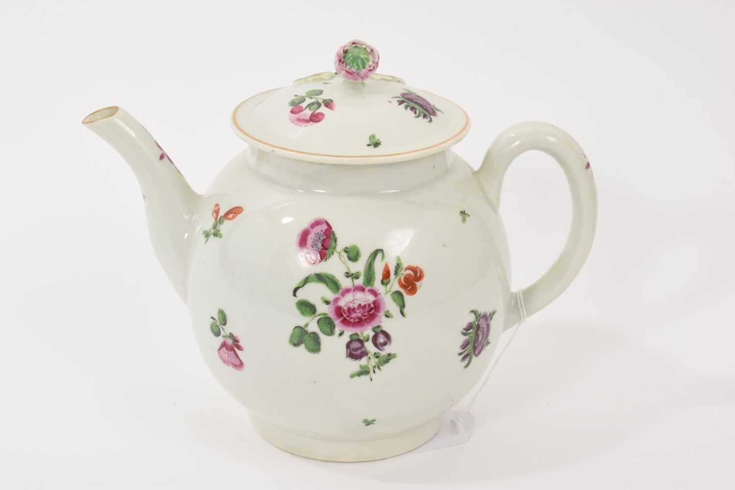 Lot 23 - A Worcester teapot, circa 1775, polychrome painted with floral sprays, 16cm high