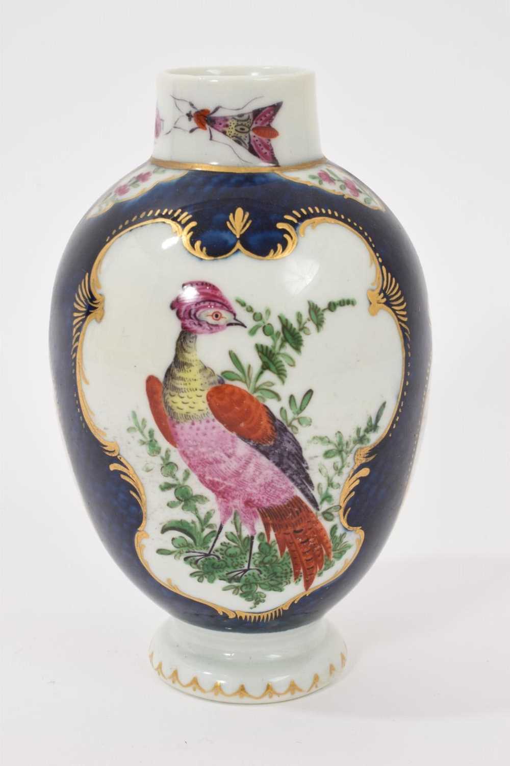 Lot 39 - A Worcester tea canister, circa 1770, polychrome painted with exotic birds, insects and flowers within gilt scroll cartouches, on a scale blue ground, square mark to base, 12.75cm high