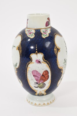 Lot 39 - A Worcester tea canister, circa 1770, polychrome painted with exotic birds, insects and flowers within gilt scroll cartouches, on a scale blue ground, square mark to base, 12.75cm high