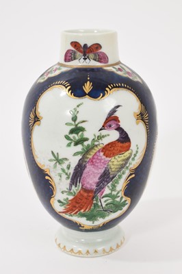 Lot 39 - A Worcester tea canister, circa 1770, polychrome painted with exotic birds, insects and flowers within gilt scroll cartouches, on a scale blue ground, square mark to base, 12.75cm high