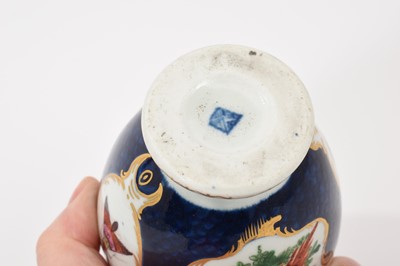 Lot 39 - A Worcester tea canister, circa 1770, polychrome painted with exotic birds, insects and flowers within gilt scroll cartouches, on a scale blue ground, square mark to base, 12.75cm high