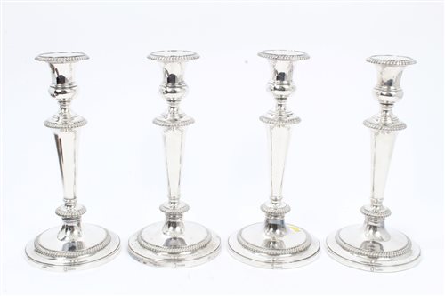 Lot 369 - Set of four 19th century EPNS candlesticks...