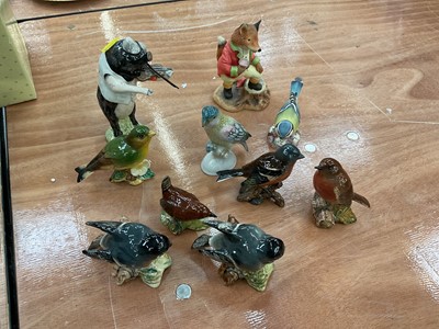 Lot 404 - Group of Beswick birds, Beswick pig band figure and a Villeroy & Boch Foxwood tales figure.