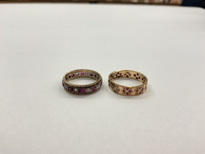 Lot 1012 - Two 9ct gold synthetic ruby and white stone eternity-style dress rings