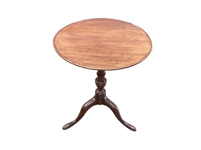 Lot 1251 - 19th century mahogany wine table with circular tilt top on turned column and three splayed legs, 56cm diameter