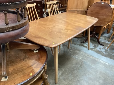 Lot 1252 - Ercol extending dining table with two extra leaves opening to 226cm x 90cm (155cm with no leaves) together with a set of eight Ercol stick back chairs including one carver