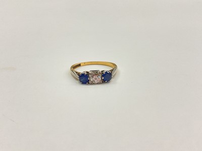 Lot 1020 - 18ct gold sapphire and diamond three stone ring