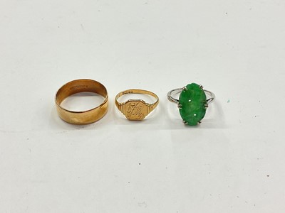 Lot 1032 - 9ct gold thick band wedding ring, 9ct gold signet ring and 9ct white gold carved jade/ green hardstone panel ring (3)