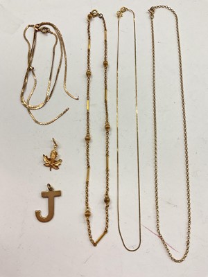 Lot 1038 - Four 9ct gold/ yellow metal chains and two 9ct gold pendants