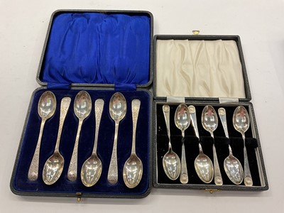 Lot 1059 - Two sets of six silver teaspoons in fitted cases