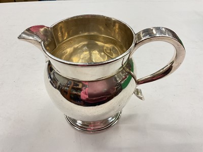 Lot 1152 - Large silver milk jug (London 1915), 11cm high