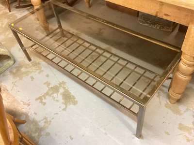 Lot 1291 - Brass framed coffee table with smoked glass top and magazine rack undertier, 122.5cm x 46.5cm x 41cm high