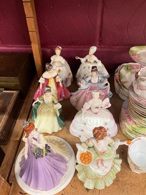 Lot 693 - Nine porcelain figures of ladies, including Royal Doulton and Coalport