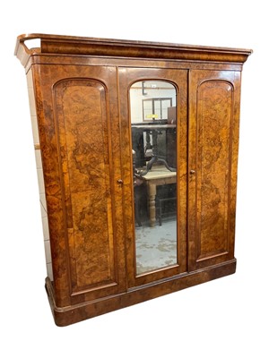 Lot 1295 - Victorian walnut bedroom suite comprising triple wardrobe with central mirrored door flanked by panelled doors, dressing table with raised mirror back