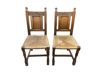 Lot 1296 - Set of six oak dining chairs with rush seats comprising four standards and two carvers