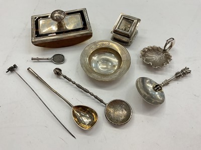 Lot 1109 - Group of silver and white metal items including a silver Armada dish, Victorian leaf shaped caddy spoon, other spoons, silver stamp holder, silver desk blotter, silver tennis racket brooch and a...