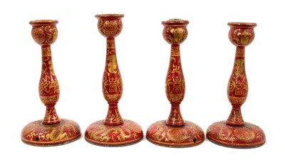 Lot 1045 - A set of four antique lacquered chinoiserie lamp bases