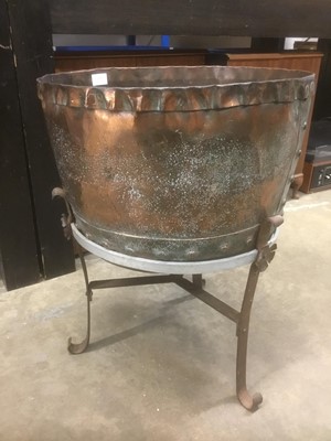 Lot 171 - Antique riveted copper vessel, raised on metal stand