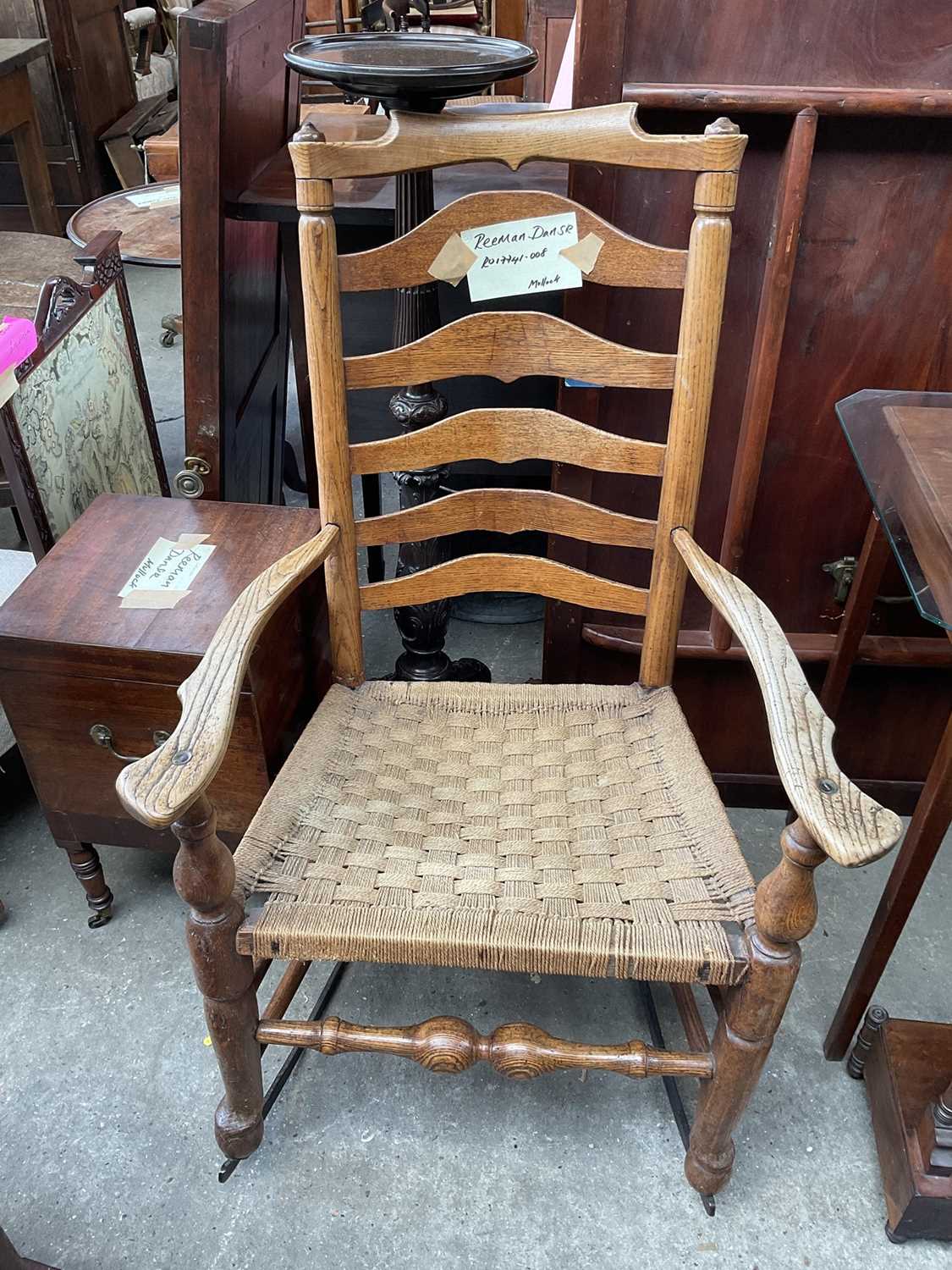 Lot 5350 - Antique elm ladder back rocking chair