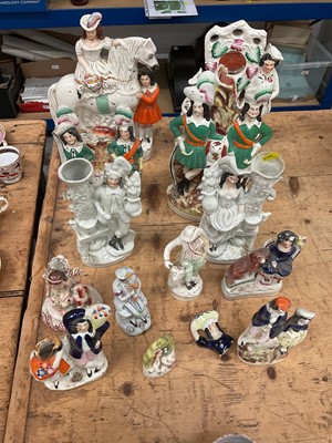 Lot 25 - Group of Victorian Staffordshire figures, including spill vases, pocket watch holder, etc