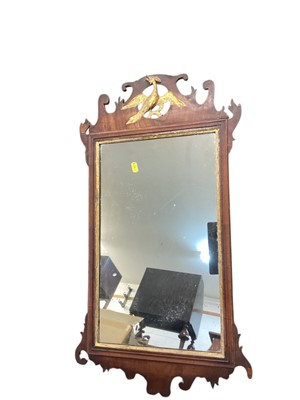 Lot 1309 - Georgian style mahogany wall mirror with parcel gilt decoration, 79cm x 42cm