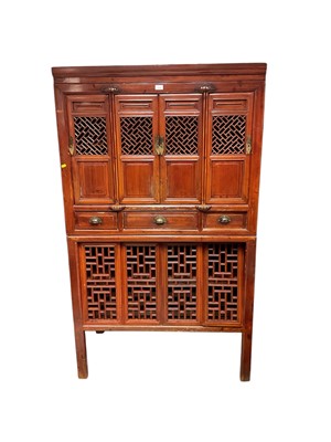 Lot 1312 - Oriental cabinet with three drawers and eight pierced and panelled doors, 106.5cm wide, 56cm deep, 181cm high