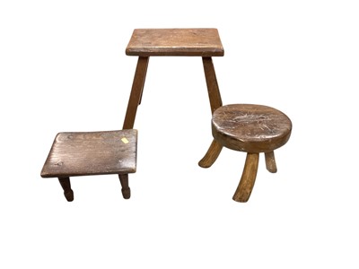 Lot 1350 - Three rustic milking stools