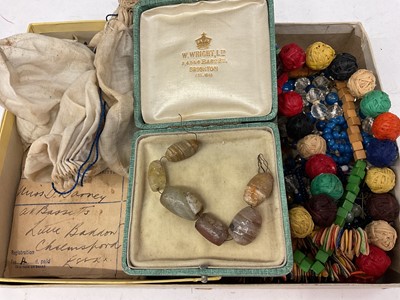 Lot 1113 - Antique, possibly Egyptian, carved hard stone beads, together with other loose vintage glass beads and various bead necklaces