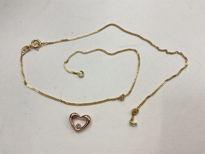 Lot 1123 - 9ct gold heart shape pendant set with a diamond and an 18ct gold chain (broken)