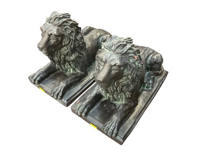 Lot 480 - Pair of bronzed terracotta sculptures in the form of recumbent lions (2).