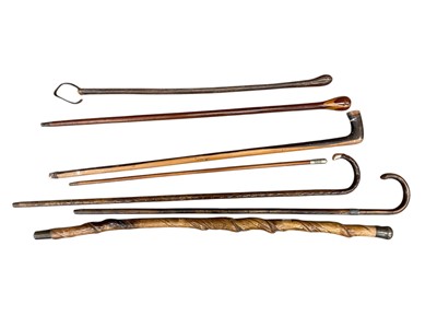 Lot 62 - Group of walking sticks and canes, including a 12k gold mounted stick and a 'Pompadours' swagger stick