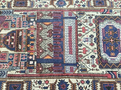 Lot 1423 - Eastern rug with geometric decoration on red, blue and beige ground, 150cm x 90cm, together with anonther blue rug, 224cm x 161cm (2)