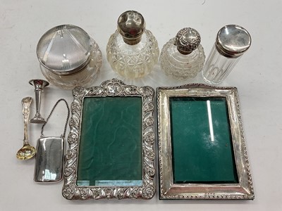 Lot 1165 - Two Edwardian silver photograph frames, Art Deco silver mounted cut glass powder jar, similar scent bottles etc